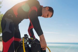 A diver assembling his gear
