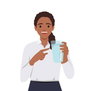 A woman holding a cup of water
