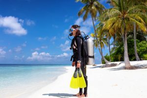 A scuba diver getting ready for shore diving