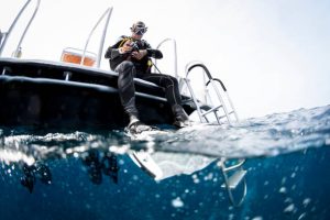 A scuba diver on a boat