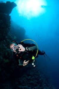 A diver signaling ok sign