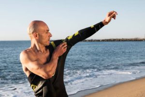 An individual wearing his wetsuit
