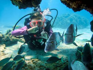 a kid practicing scuba diving