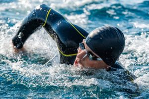 a swimmer wearing a wetsuit
