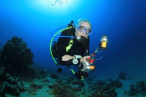 A senior scuba diver underwater