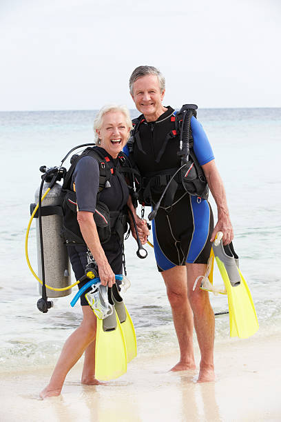 two scuba diving seniors