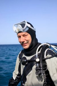 a scuba diver wearing a drysuit