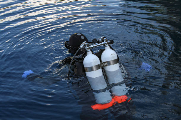 a scuba diver with two scuba tanks