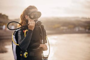 a diver holding a scuba regulator