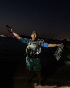 a diver ready to delve into a night dive