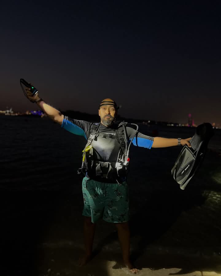 a diver ready to delve into a night dive