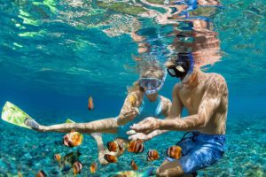 Wearing underwater goggles