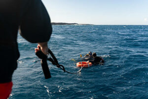 Two dive buddies on the surface of the water