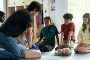 Children learning CPR